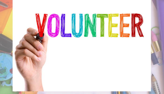  hand holding volunteer sign 