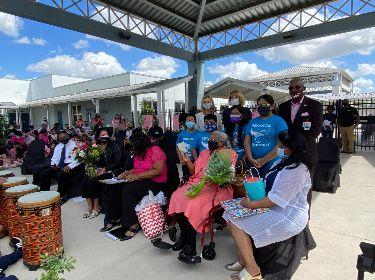 Students present flowers and cards 