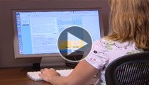 student sitting at computer 