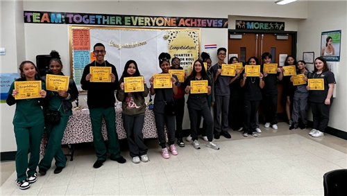 Quarter 1 Honor Roll Students holding their certficates